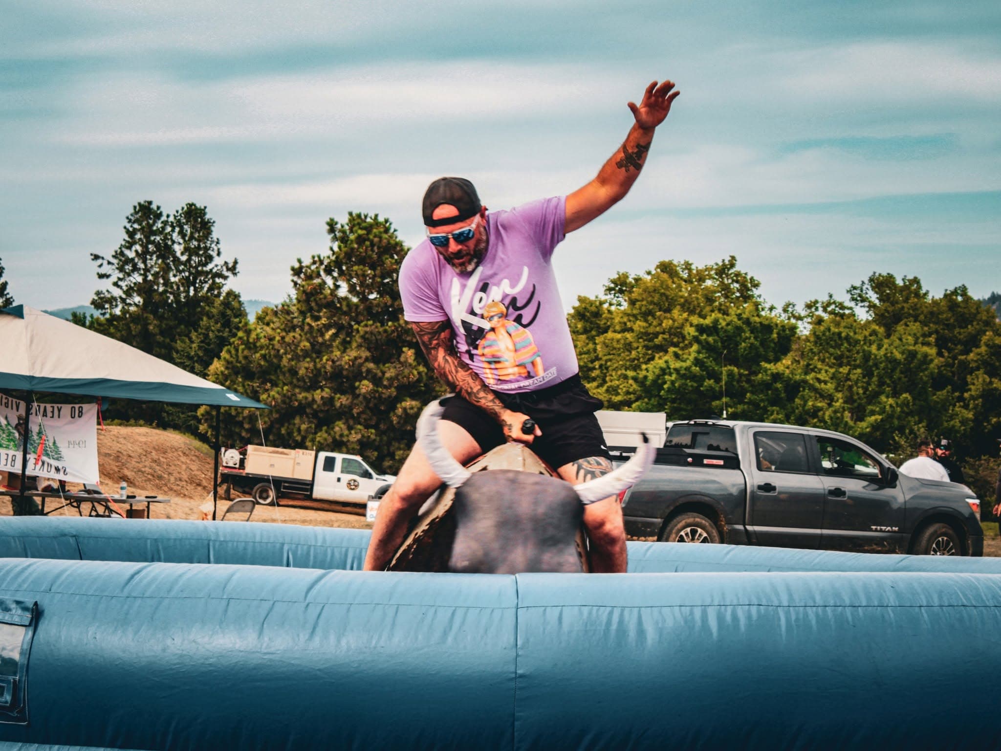 Guy riding Bull Machine Two Rivers Resort Festival